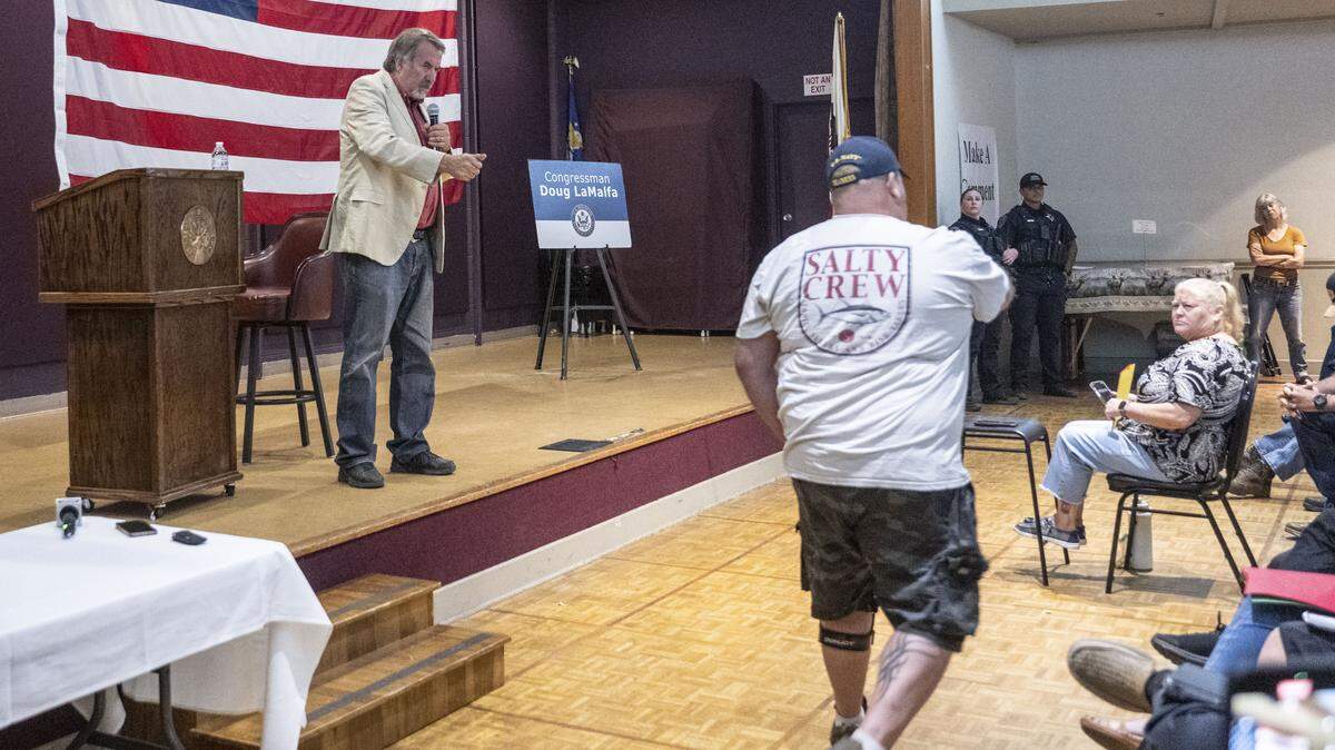 Rep. Doug LaMalfa, R-Chico, stretches his hand toward veteran Ryan Rogowski, 48, of Chico, who asked a question about the lack of services for mental health during a town hall meeting on Monday, Aug. 11, 2025, in Chico.