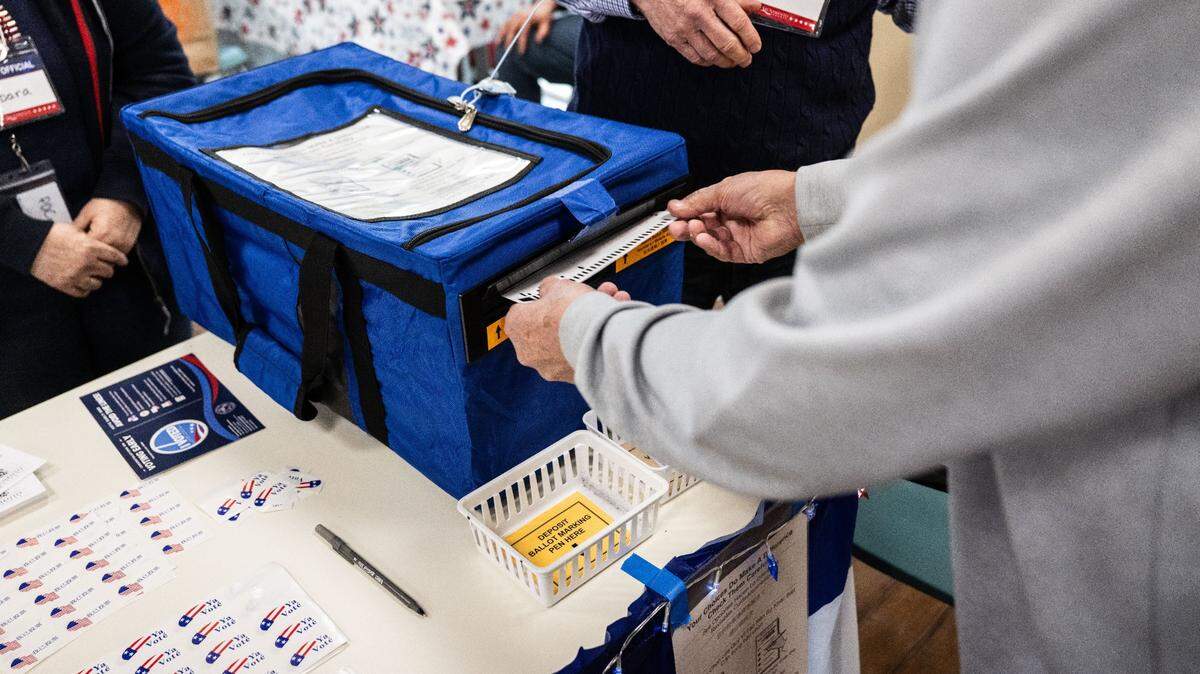 Greg Purcell, of Sacramento turns in this ballot at the Robbie Waters Pocket-Greenhaven library on Tuesday, March 5, 2024.