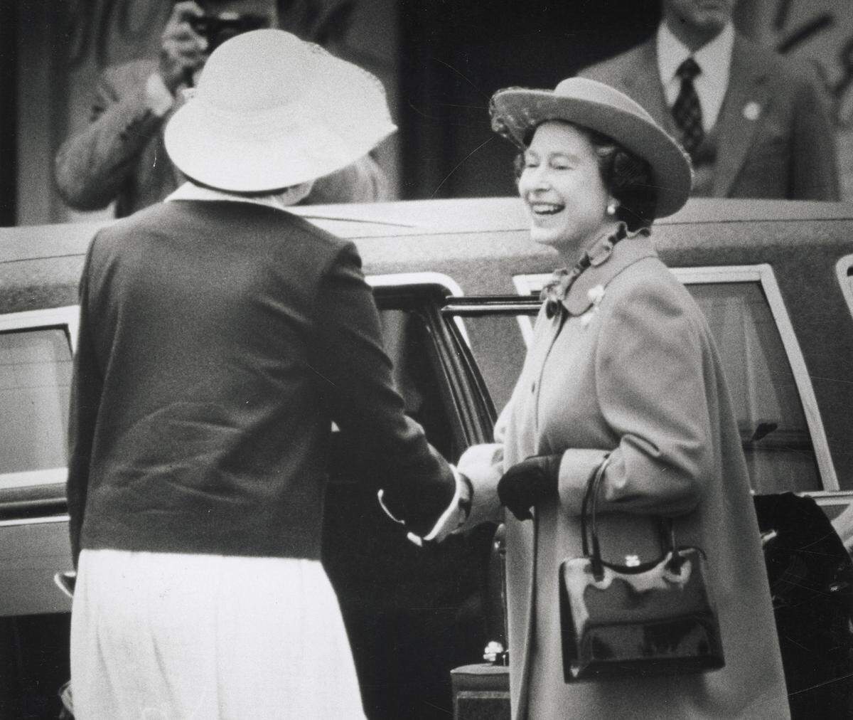 Queen Elizabeth II returns to her limousine after visiting Sutter’s Fort in Sacramento on March 4, 1983.
