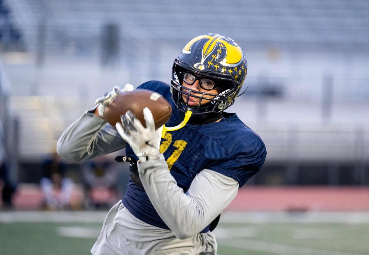 Oak Ridge Trojans tight end Kaleb Edwards catches a pass during practice on Tuesday in El Dorado Hills.