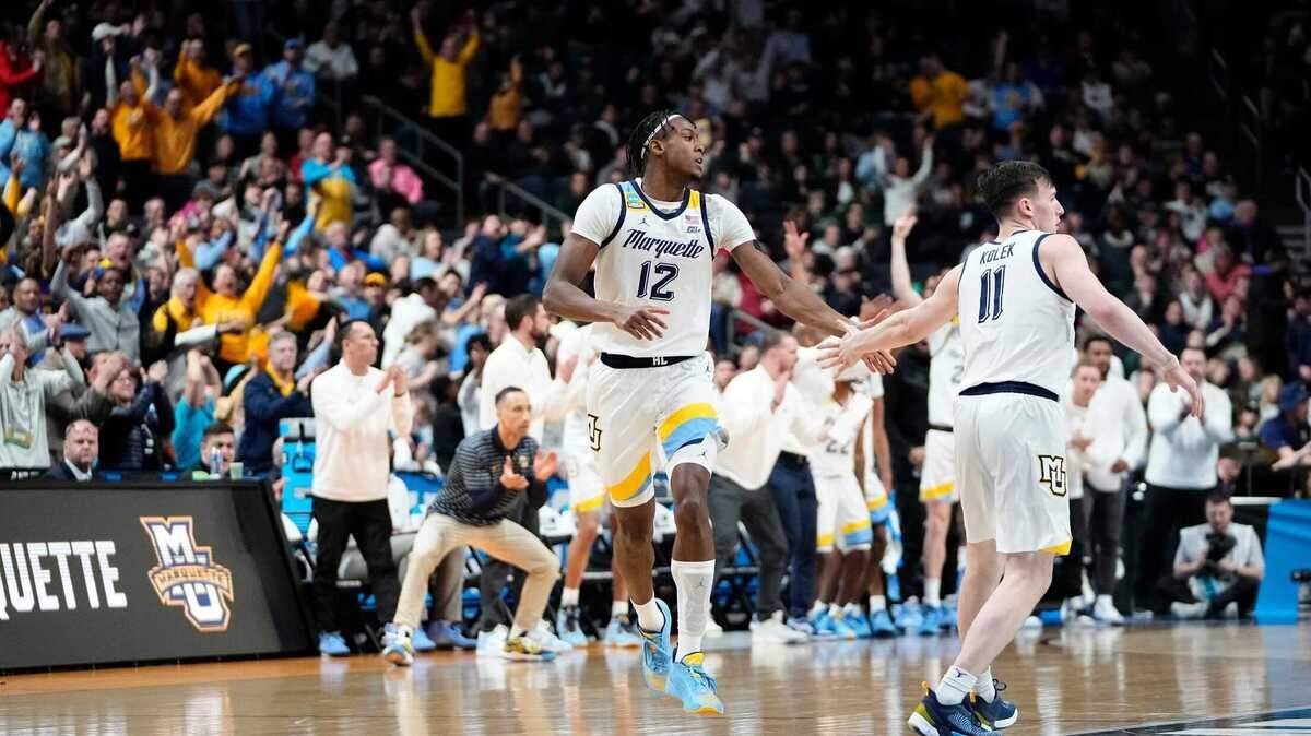 Marquette Golden Eagles forward Olivier-Maxence Prosper (12) and guard Tyler Kolek (11) celebrate a shot during the second round of the NCAA men’s basketball tournament against the Michigan State Spartans on March 19, 2023, at Nationwide Arena in Columbus, Ohio.