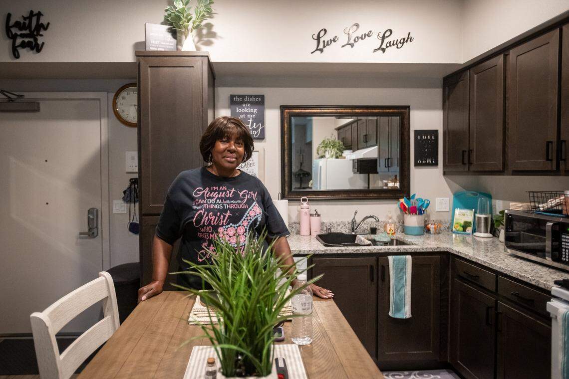 Robin Watkins stands in her new kitchen on Aug. 17 after recently moving in to her affordable housing unit in Lavender Courtyard by Mutual Housing in midtown Sacramento. “I was totally shocked,” she said about getting accepted after a lottery process. “It was just like a blessing from God because I had been looking and looking and looking.”