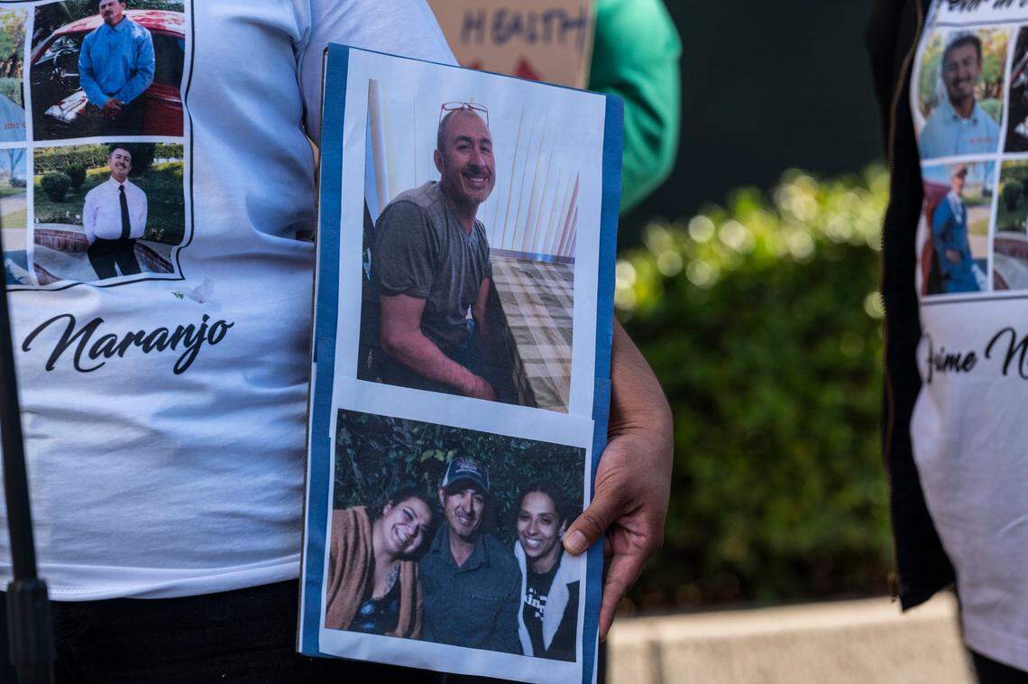 Shavon Acosta holds photos of her father Jaime Naranjo, who was killed by a Sacramento Sheriff’s deputy last week, at a press conference on Tuesday, Oct. 4, 2022.