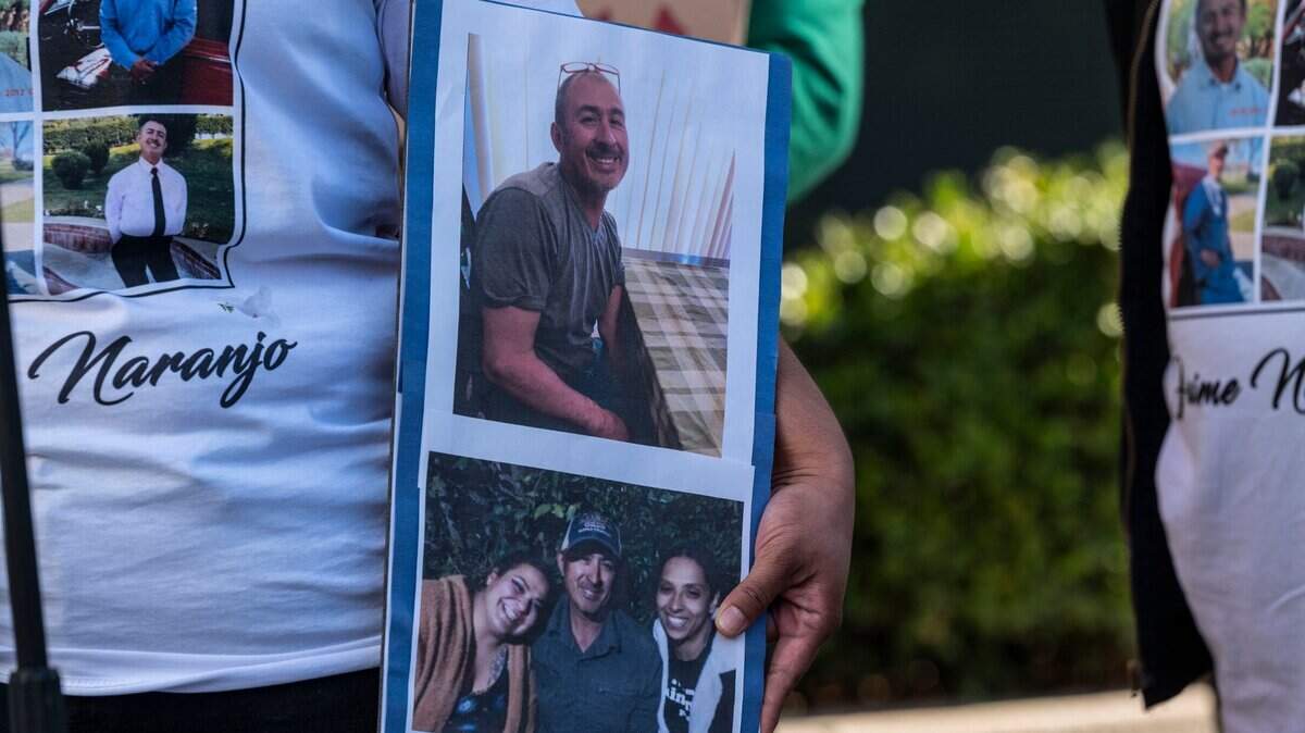 Shavon Acosta holds photos of her father Jaime Naranjo, who was killed by a Sacramento Sheriff’s deputy, at a press conference in 2022. 
