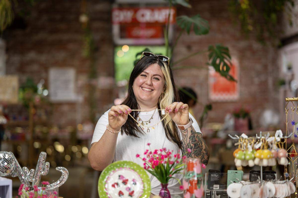 Golden Hour Designs owner, Amanda Jensen, poses for a portrait at the store in Oak Park on Tuesday, March 31, 2026.