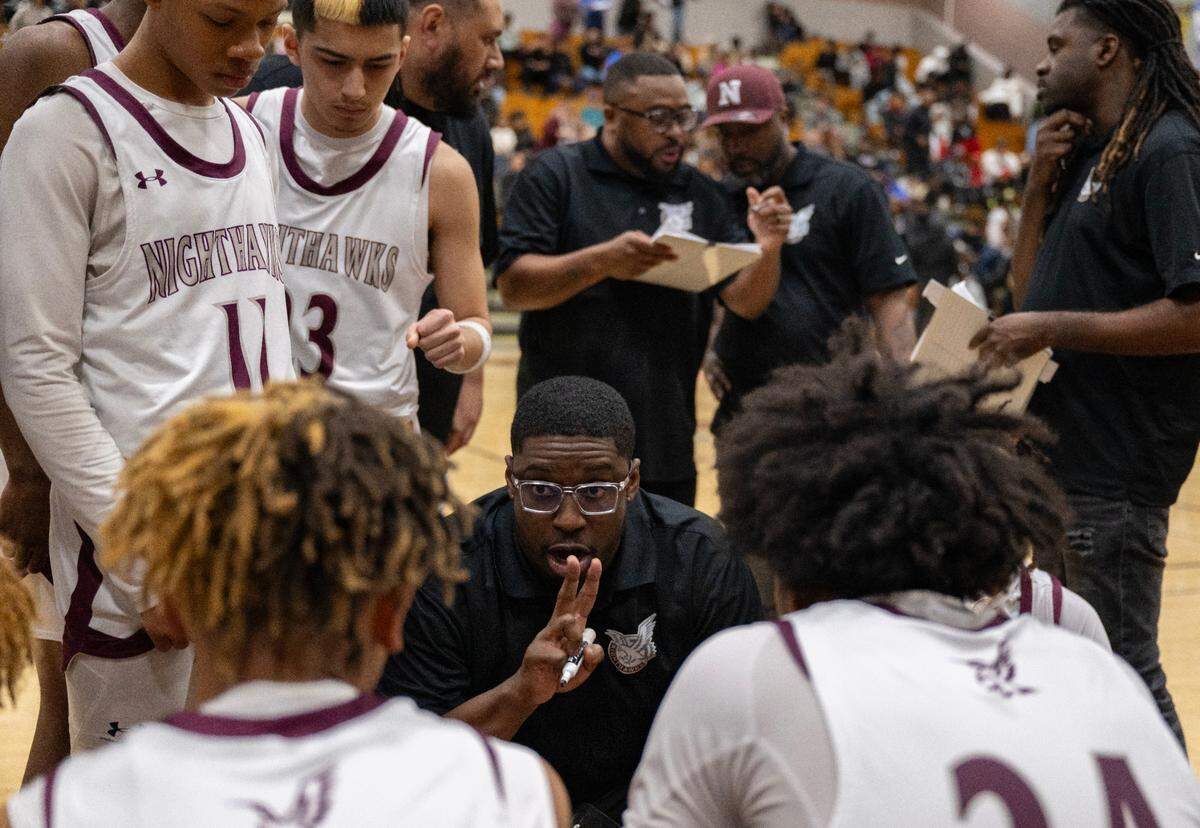Natomas Nighthawks boys basketball coach Brian McKenzie calls a play during a timeout against the Monterey Dores in a CIF Northern California regional Division IV semifinal on Saturday, March 2, 2024, in Sacramento.