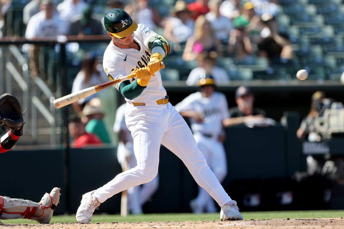 Athletics right fielder Brent Rooker (25) hits a two-run home run against the Cincinnati Reds during the seventh inning at Sutter Health Park on Sunday. 