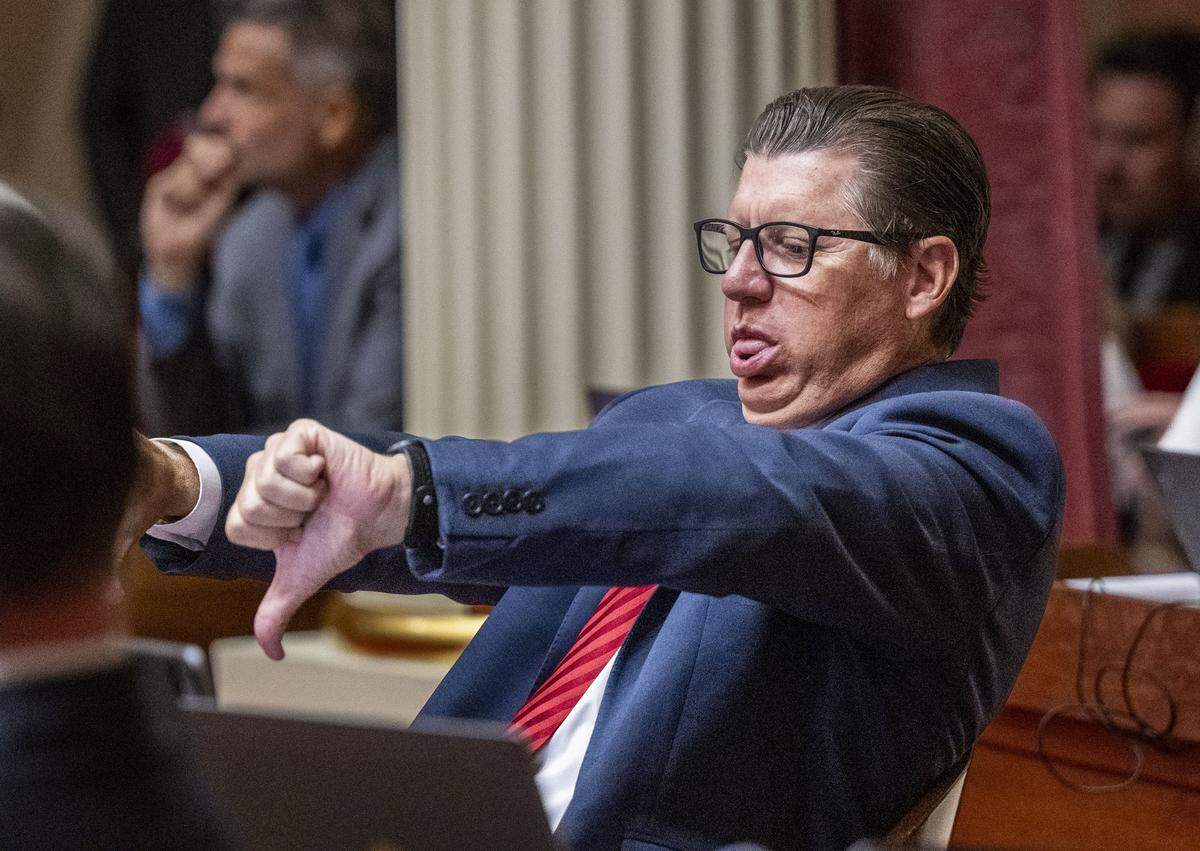 Senate Minority Leader Brian Jones, R-Santee, gestures with his thumbs down as state Sen. Aisha Wahab, D-Hayward, speaks in support of the bills to enact Gov. Gavin Newsom’s redistricting plan on Thursday, Aug. 21, 2025, at the California Capitol. 