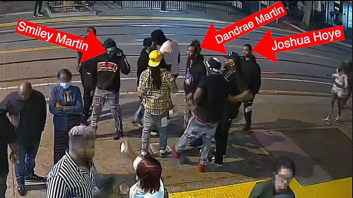 In an image captured from surveillance video and labeled by Sacramento police, gang members are identified moments before a shooting April 3, 2022, in downtown Sacramento. Six people were killed and 12 others were wounded in the shootout. Prosecutors on Tuesday charged Deandrae and Smiley Martin and Mtula Payton with the murders of three women killed in the gunfight.