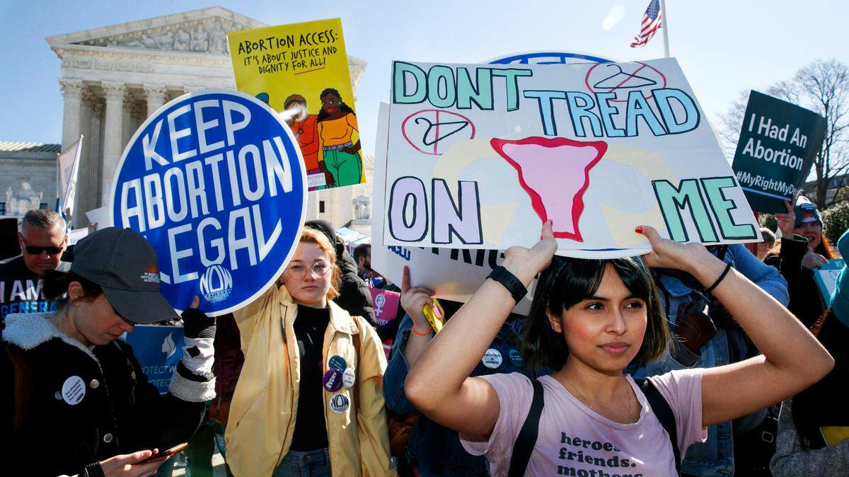 Abortion rights demonstrators including Jaylene Solache, of Dallas, Texas, right, rally, Wednesday, March 4, 2020, outside the Supreme Court in Washington.