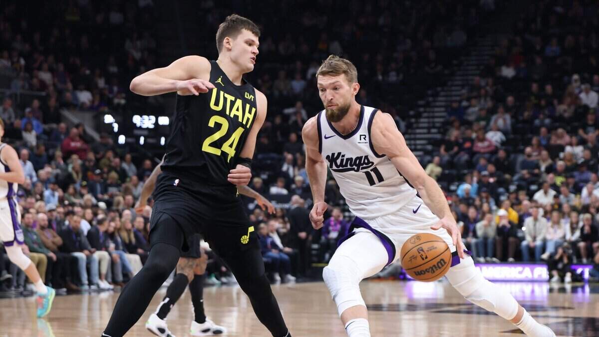 Oct 29, 2024; Salt Lake City, Utah, USA; Sacramento Kings forward Domantas Sabonis (11) drives to the basket against Utah Jazz center Walker Kessler (24) during the first quarter at Delta Center. Mandatory Credit: Rob Gray-Imagn Images