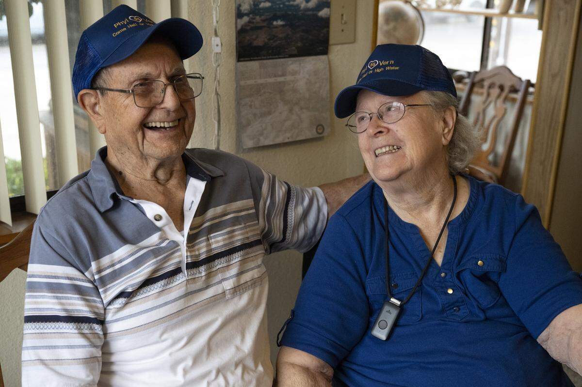Vern Hill and his wife Phyllis pose for a photo at their home in Yuba City earlier this month. The couple married only days before the historic flood in Yuba City in 1955.