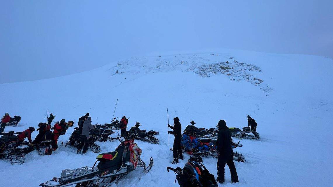 An avalanche near Winter Park buried two snowmobilers with one still missing, Colorado officials say.
