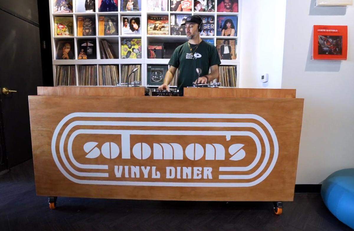 DJ Dustin Worswick spins some tunes in Solomon’s Vinyl Diner on Wednesday.