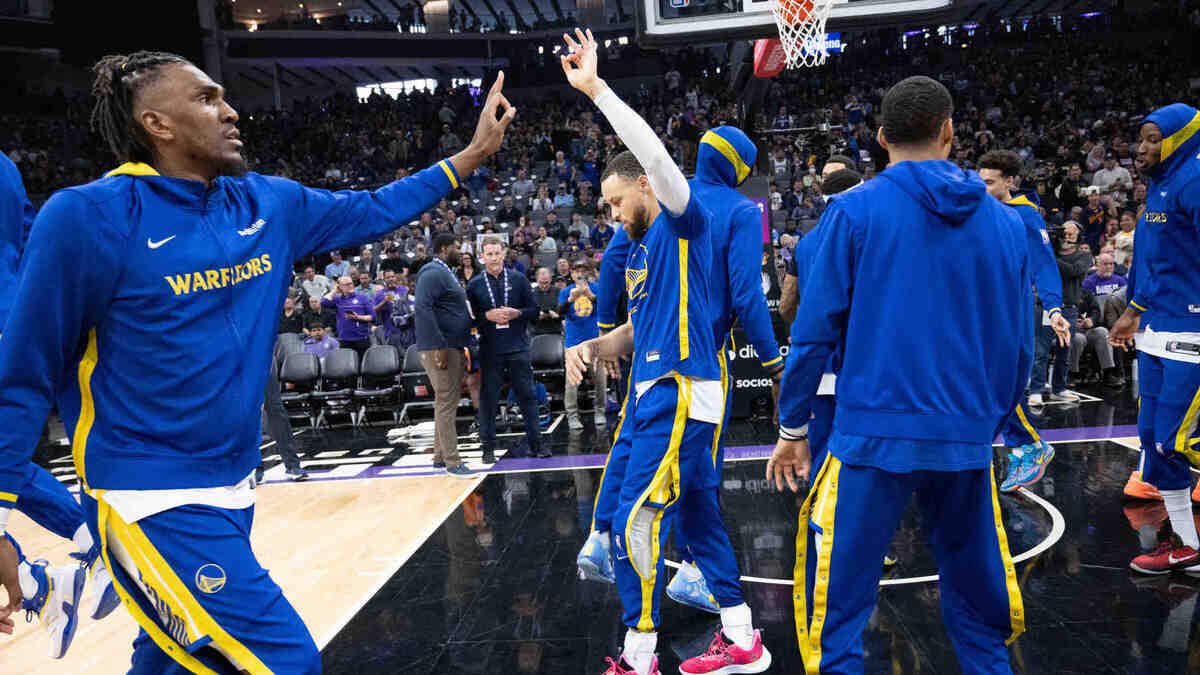 Golden State Warriors forward Kevon Looney (5) and teammate Golden State Warriors guard Stephen Curry (30) are introduced during an NBA game between the Sacramento Kings and the Golden State Warriors on Friday, April, 7, 2023 at Golden 1 Center.