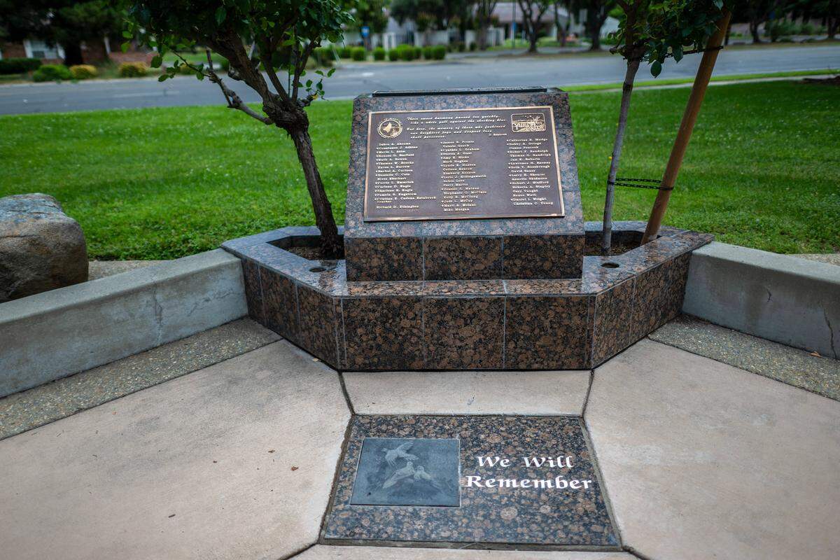 A Yuba City memorial built in 2011 displays the names of the those who died and those who survived the 1976 bus crash that killed 28 Yuba City High School choir students and a teacher stands. Alongside it is a plaque with the words “we will remember,” the same words that were on a message board outside the school the day of the crash. 