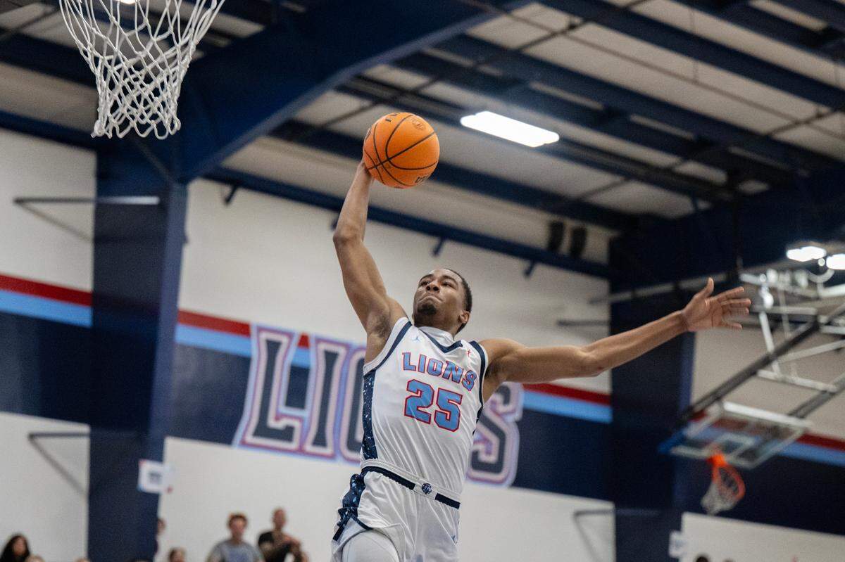 The Destiny Christian Lions’ Myles Wiggins (25) finishes off a fast break against the Destiny Christian Lions’ in the first half of the CIF Northern California Division Il semifinal game on Saturday, March 7, 2025 in Sacramento.