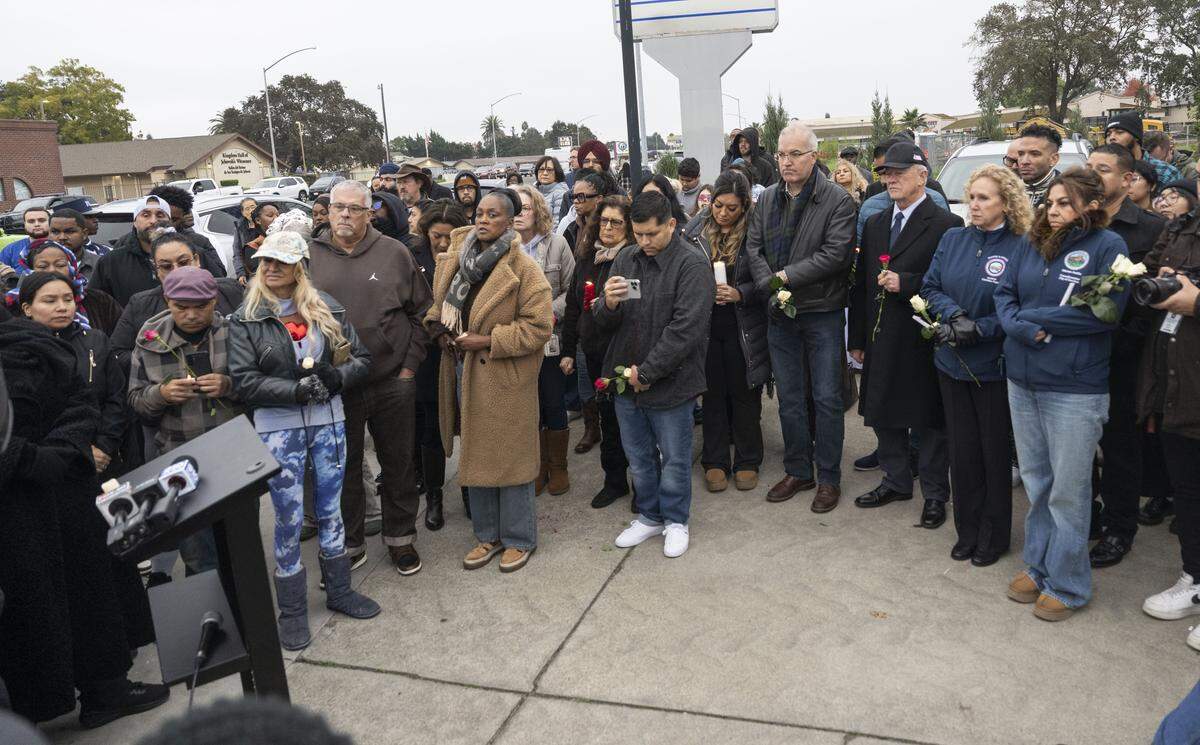 Community members mourn at a vigil in Stockton on Nov. 30 for the four people killed and 11 injured in a mass shooting the night before.