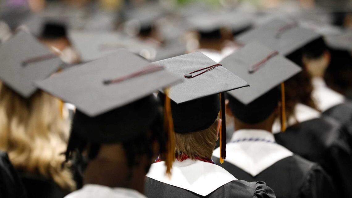 Seniors stand during a graduation ceremony at an Elk Grove Unified School District high school. The district is among the most diverse in California, according to Niche.