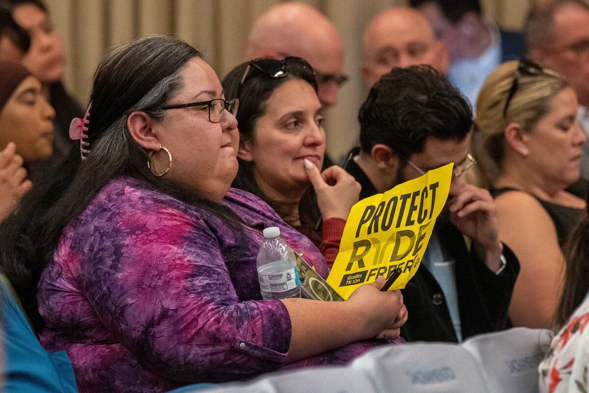 April Ybarra, left, and Vanessa Cudabac, right, wait to speak against the elimination of RydeFreeRT free fare program for K-12 students at a Sacramento City Council meeting on Tuesday. Both are parents of students, and Cudabac is also a teacher.