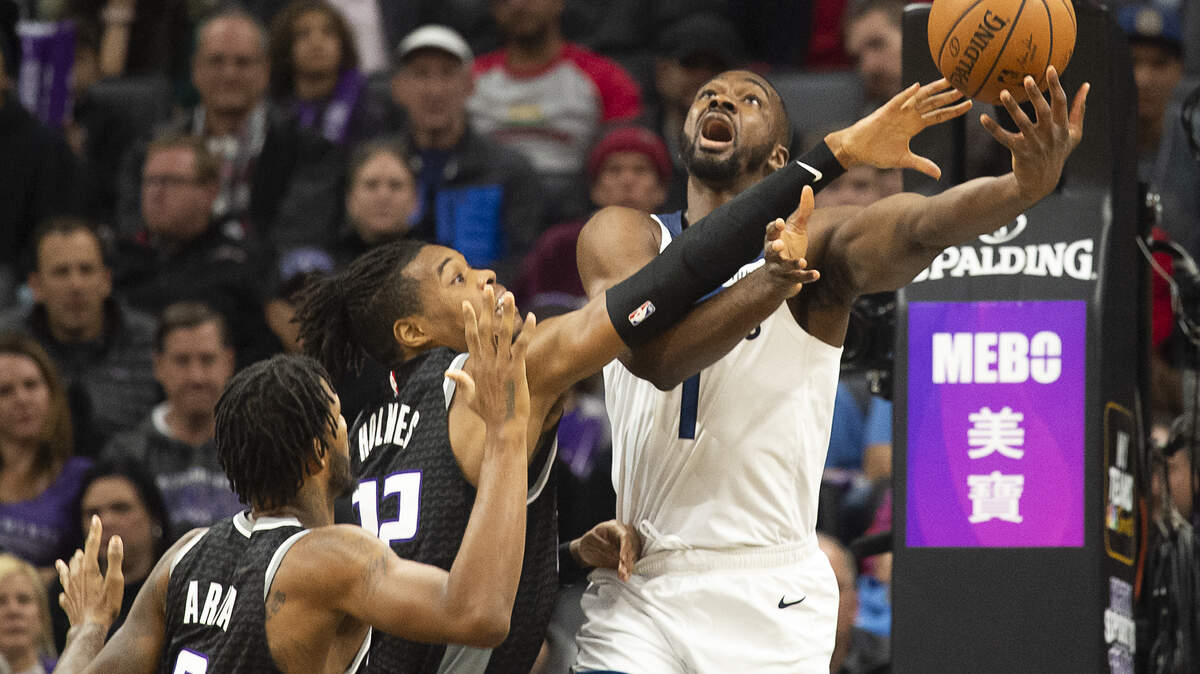 Sacramento Kings forward Richaun Holmes (22) tires to block shot by Minnesota Timberwolves forward Noah Vonleh (1) during a game at Golden 1 Center on Thursday, Dec 26, 2019 in Sacramento.