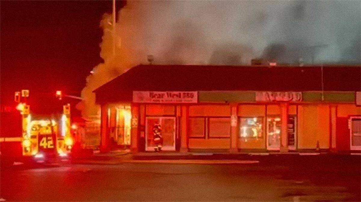 Smoke is seen pouring from Bear West BBQ on the 5900 block of Watt Avenue in North Highlands after a fire sparked on the exterior of the shopping center on Thursday, Oct. 2, 2025.