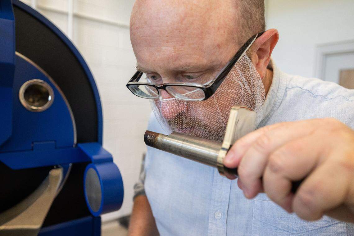 William Ristenpart, Director of the UC Davis Coffee Center, smells roasted coffee beans at the center Sept. 11.