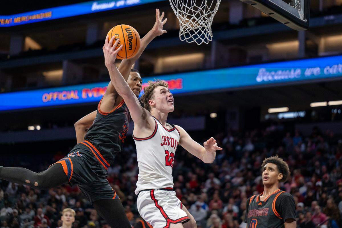 The Jesuit Marauders’ Asher Schroeder (22) scores a basket against the Chatsworth Chancellors in the CIF State Division II boys basketball final on March 15 at Golden 1 Center. Schroeder is the boys basketball Large School Player of the Year.
