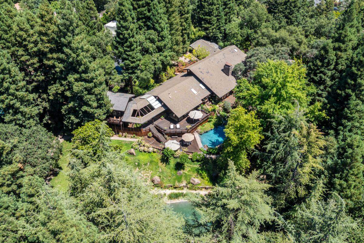 A look at the massive lot with a lush, secluded yard.