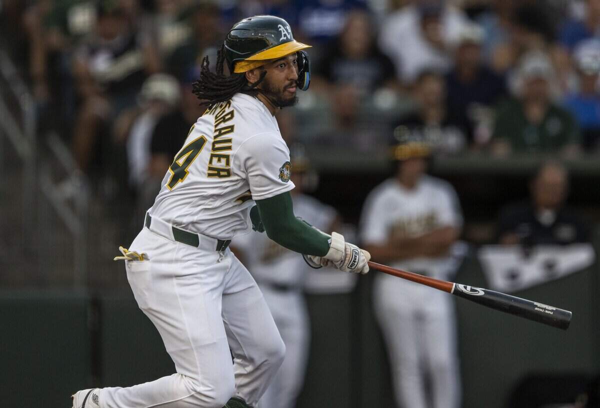 The Athletics’ Joshua Kuroda-Grauer (44) gets a hit during his debut game against the Los Angeles Dodgers on Monday at Sutter Health Park.