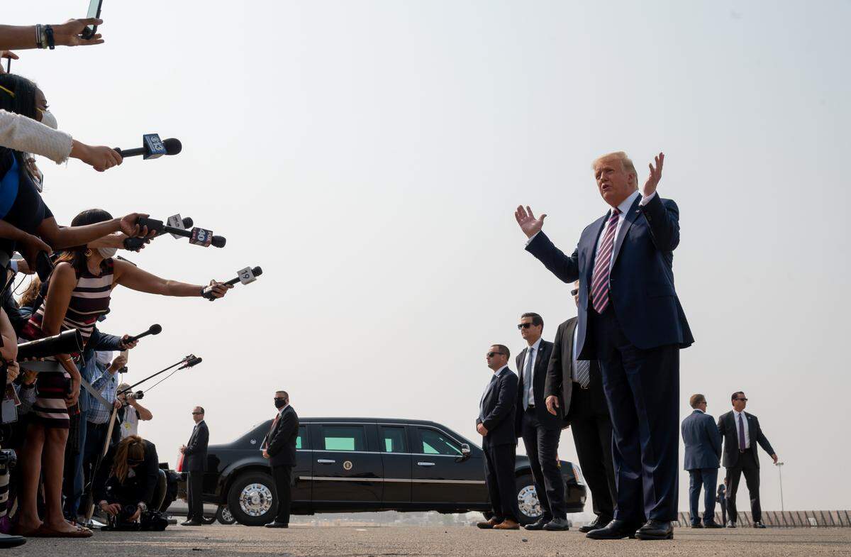 President Donald Trump speaks to the media before he meets with California Gov. Gavin Newsom and officials to discuss recent wildfires in the western states at Sacramento McClellan Airport on Monday, Sept. 14, 2020, in Sacramento.