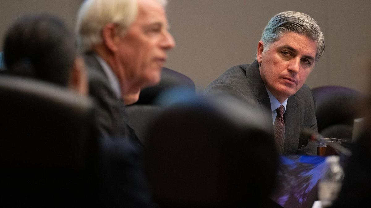 Sacramento City Councilmember Phil Pluckebaum listens to Councilmember Roger Dickinson during a City Council meeting in 2024. 