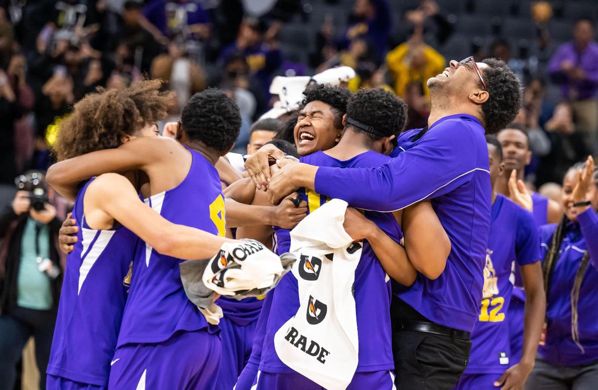 The Lynwood Knights celebrate their 89-58 win over the Sierra Chieftains in the CIF Division V high school boys basketball state final game Friday, March 10, 2023, at Golden 1 Center in Sacramento.