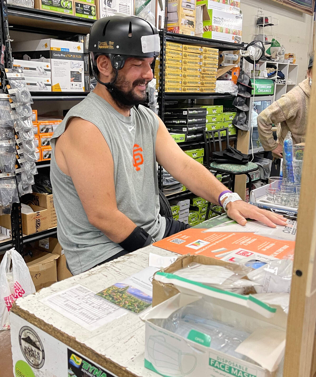 Travis Barber, 35, returns to work at Bare Roots Hydroponics & Organic Supply in Redding, California, while recovering from brain injuries suffered in an April 2021 shooting.