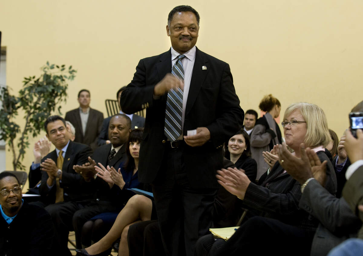 Rev. Jesse Jackson stands while he is applauded after his speech where he discussed the importance of civic engagement at the Sacramento Boys and Girls club on March 2, 2009.