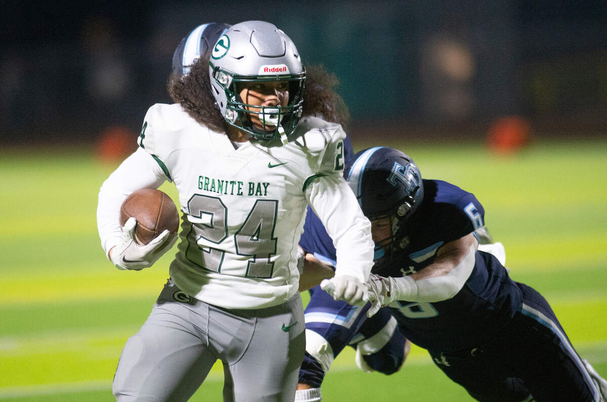 Granite Bay’s Isaiah Ene breaks free on a kick return during the CIF Sac-Joaquin Section Division II playoff game at Downey High School in Modesto, Calif., Friday, Nov.11, 2022.