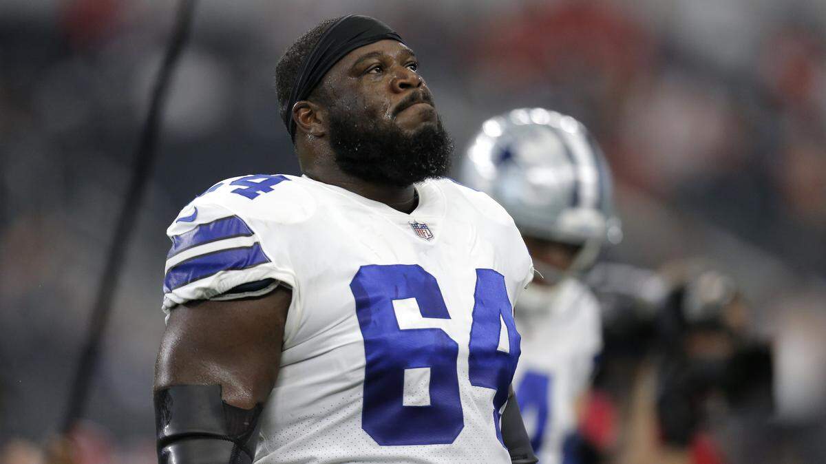 Dallas Cowboys guard Jonathan Cooper (64) walks off the field after warm ups before an NFL football game against the Kansas City Chiefs on Sunday, Nov. 5, 2017, in Arlington, Texas.