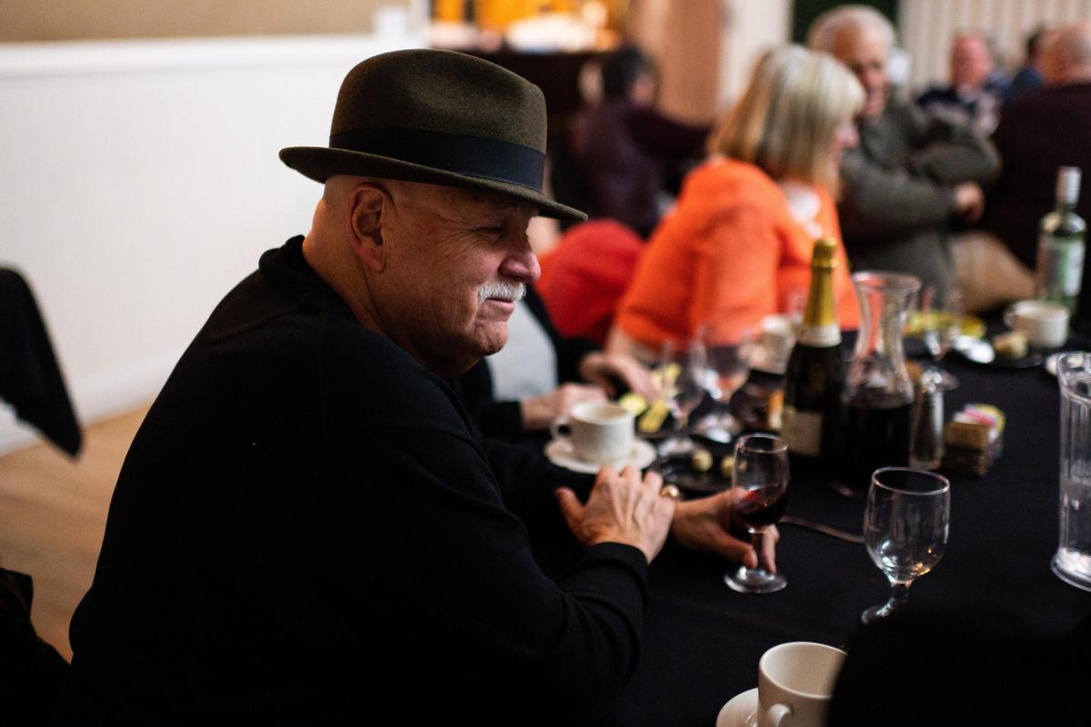 Longtime Dante Club member John Waldron sits with old friends and newcomers during the monthly Tuesday Dinner on Feb. 4.