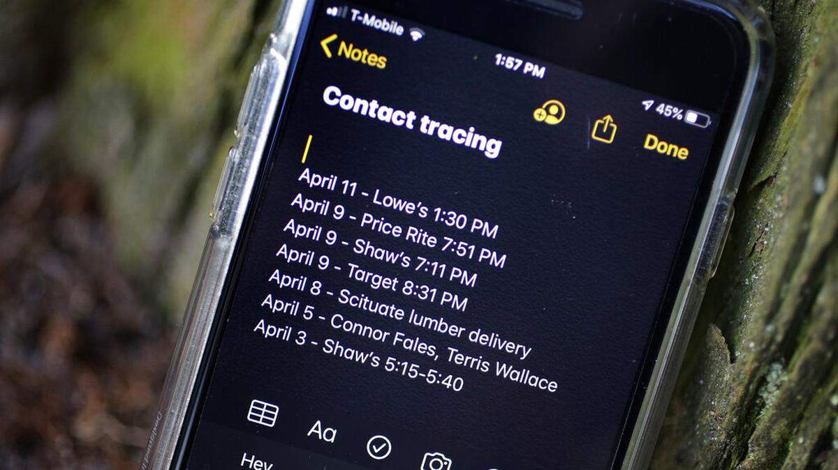 A smartphone belonging to Drew Grande, 40, of Cranston, R.I., shows notes he made for contact tracing Wednesday, April 15, 2020. Grande began keeping a log on his phone at the beginning of April, after he heard Rhode Island Gov. Gina Raimondo urge residents to start out of concern about the spread of the coronavirus. (AP Photo/Steven Senne)
