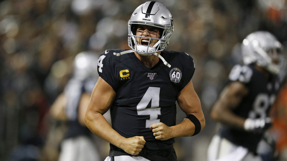 Oakland quarterback Derek Carr celebrates after a touchdown during the Raiders’ 26-14 win over the Denver Broncos on Monday.