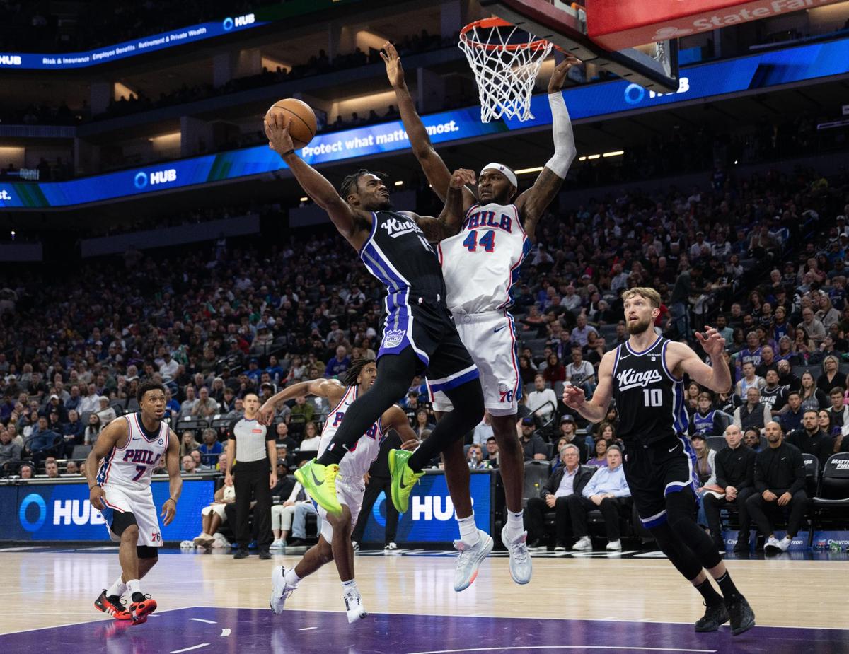 Sacramento Kings guard Davion Mitchell (15) goes to the basket against Philadelphia 76ers forward Paul Reed (44) for two points during an NBA game on Monday, March 25, 2024, at Golden 1 Center.