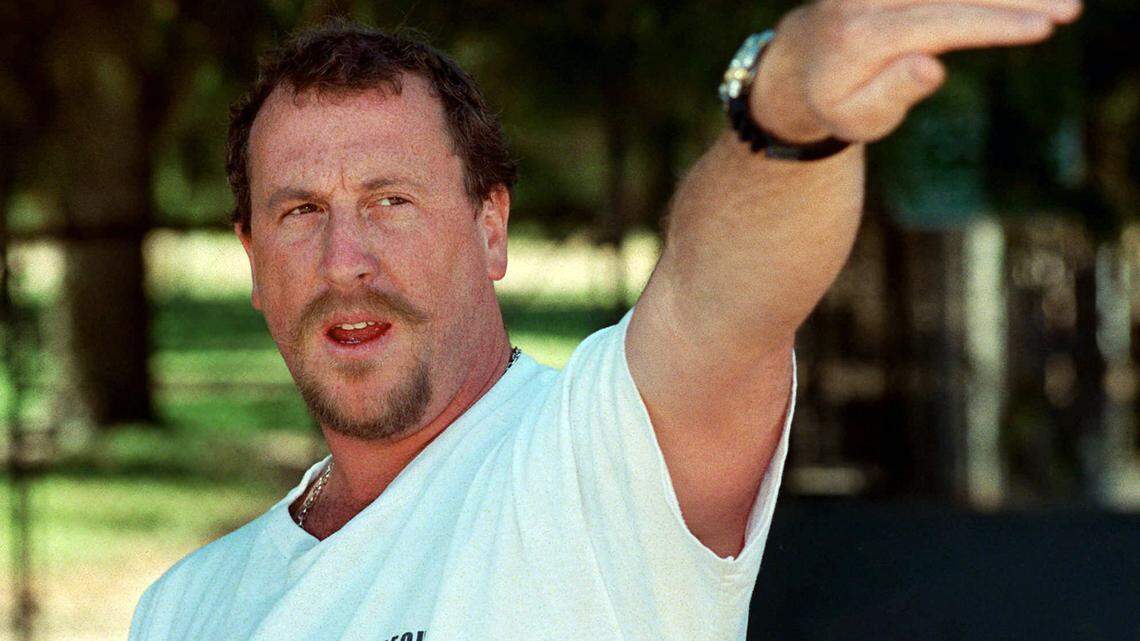 George Holliday points to the spot along a roadside in the Lake View Terrace section of Los Angeles where he videotaped Rodney King being beaten during a 1997 news conference in Los Angeles.