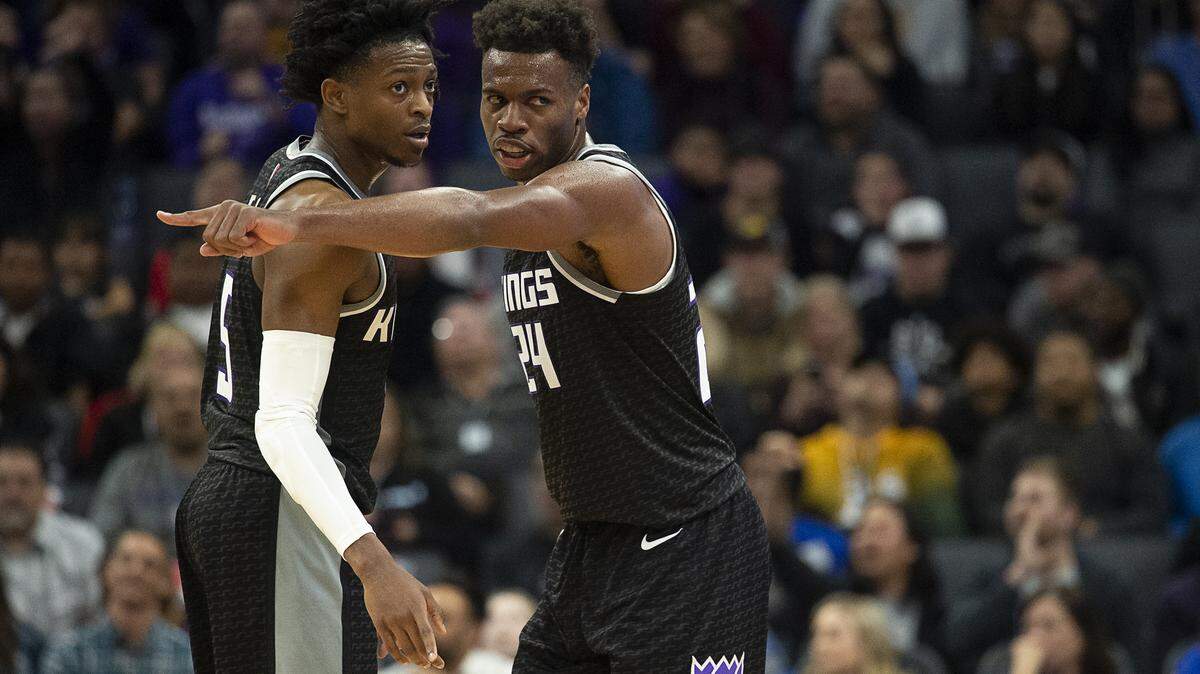 Sacramento Kings guard Buddy Hield (24) talks with Sacramento Kings guard De’Aaron Fox (5) during game against the Memphis Grizzlies at Golden 1 Center on Thursday, Jan 2, 2020 in Sacramento.