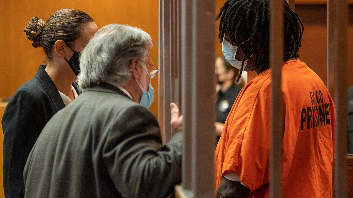 Troy Davis consults with public defenders Meghan Cunningham and Norman Dawson as he is charged with six felony counts, including murder, in Sacramento Superior Court on Tuesday, Sept. 7, 2021, in the Sept. 3 home invasion slaying of Kate Tibbitts and her two dogs on 11th Avenue in Sacramento’s Land Park neighborhood.
