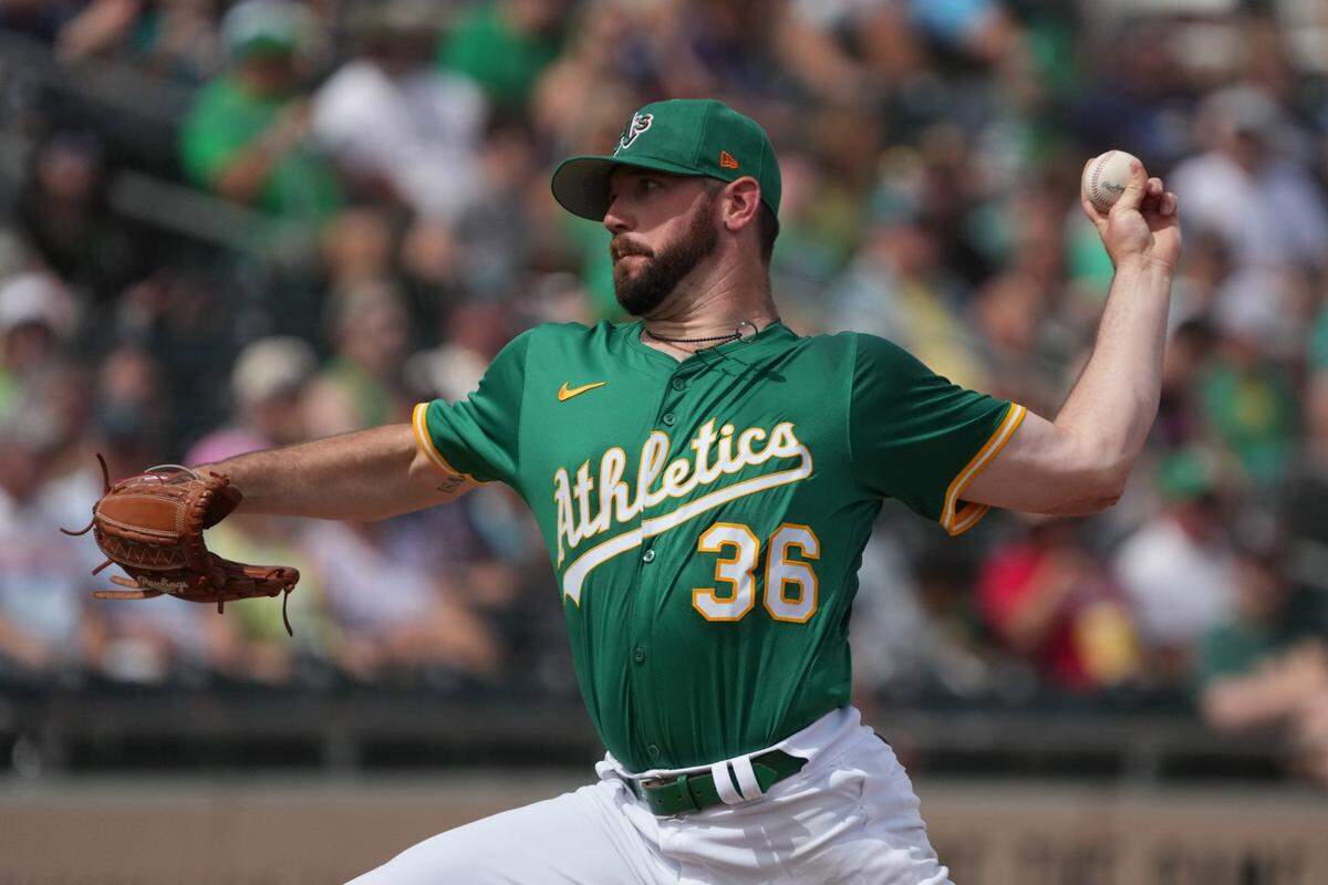 Mar 17, 2025; Mesa, Arizona, USA; Oakland Athletics pitcher Hogan Harris (36) throws against the Seattle Mariners in the second inning at Hohokam Stadium. Mandatory Credit: Rick Scuteri-Imagn Images