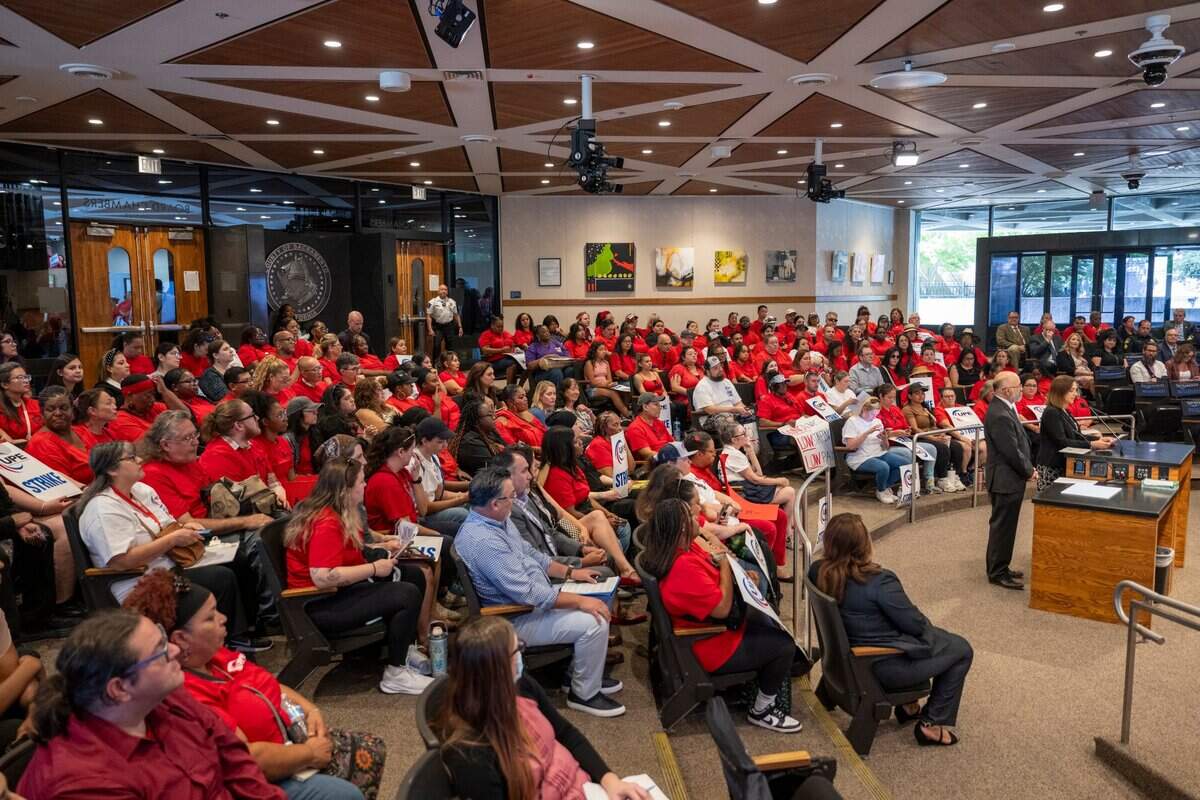 Sacramento County employees, many wearing red shirts to represent their membership in the United Public Employees union, fill the Board of Supervisors chambers in downtown Sacramento as they participate in a one-day strike for a pay increase on Tuesday, July 8, 2025.