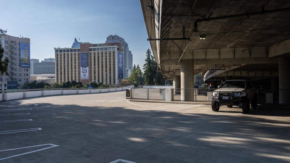 A truck sits in the city’s Old Sacramento Garage. Under a new policy, only drivers who qualify as low-income can benefit from a 50% parking discount for their electric vehicles.