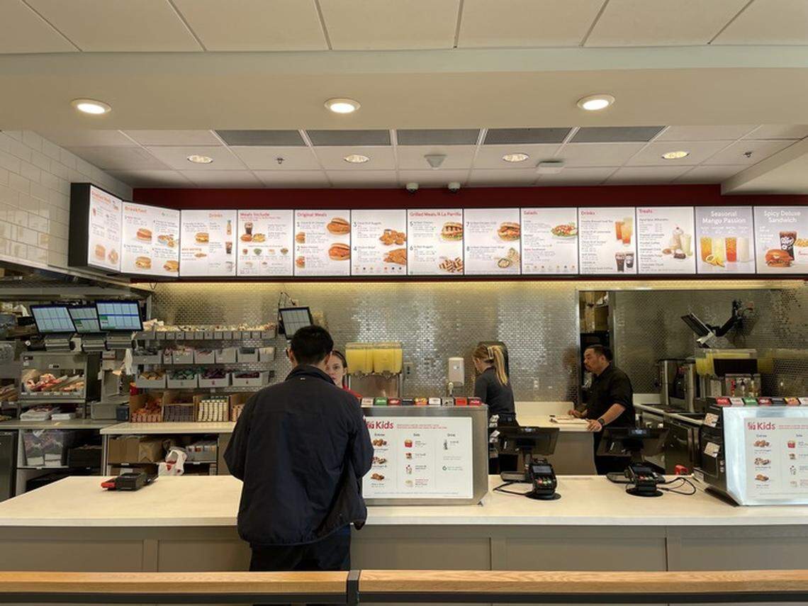 A customer orders food at Chick-fil-A on Tuesday, Feb. 20, 2024, at 2101 Alta Arden Expressway. The fast-casual chain reopened its only location in Arden Arcade after six months of reconstruction.