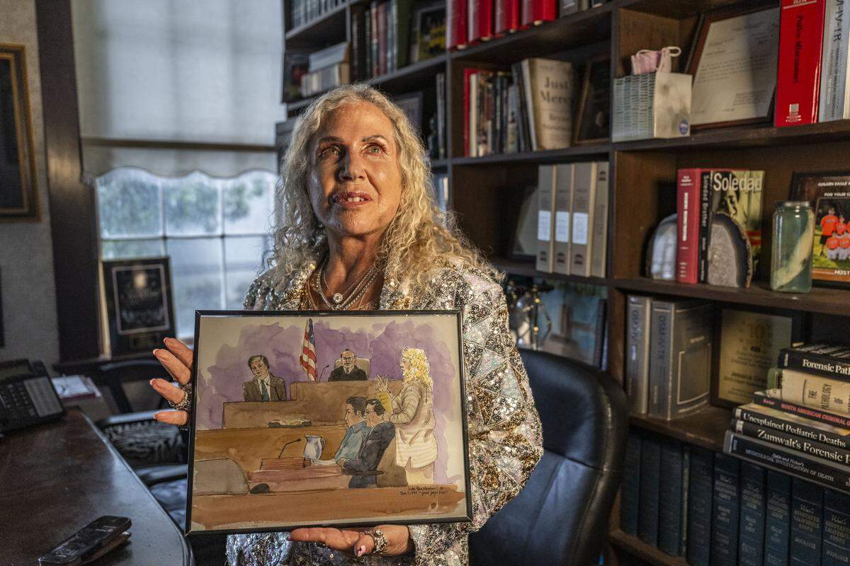 Linda Parisi, a Sacramento attorney, holds a courtroom sketch from the trial of Lou Khac Nguyen as she sits in her office in Sacramento on Wednesday. Parisi represented Lou Khac Nguyen — the lone suspect that survived the hostage shooting in April 1991 at the Good Guys in Sacramento. 