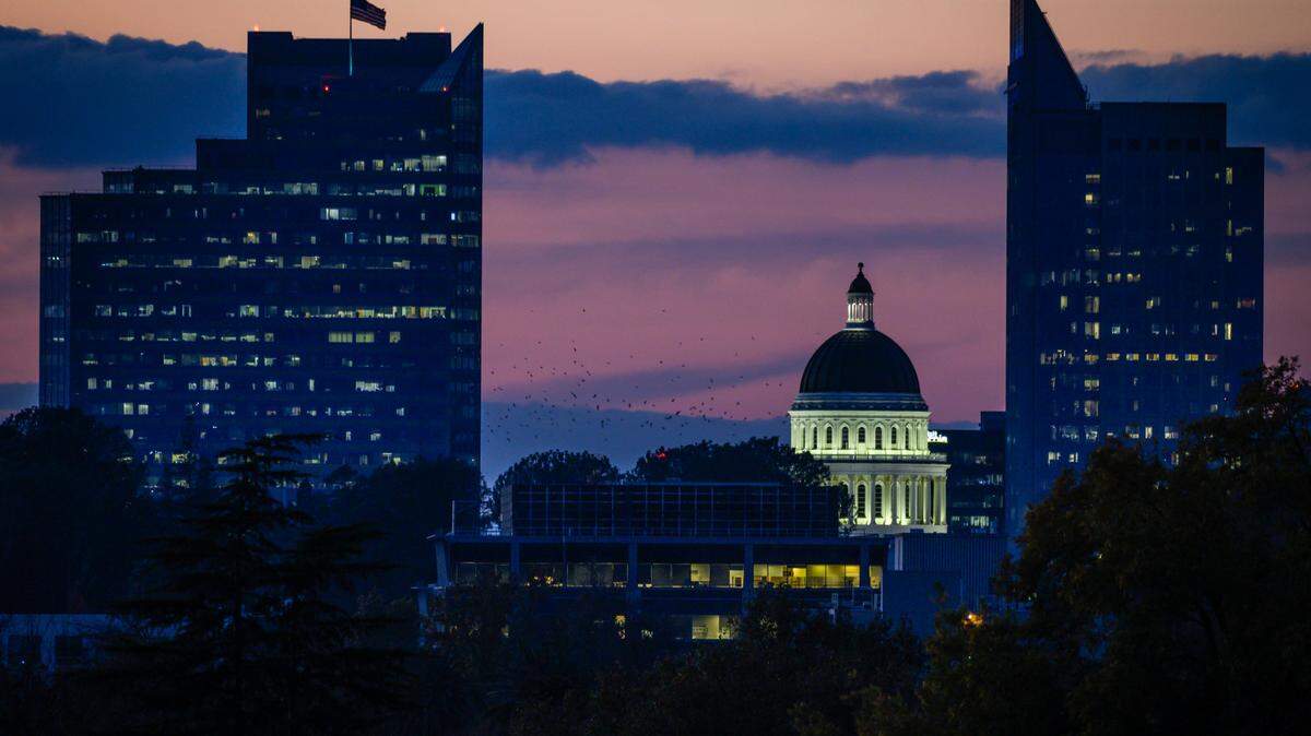 The Capitol dome glows on Thursday, Nov. 14, 2019, after the sunset in downtown Sacramento.